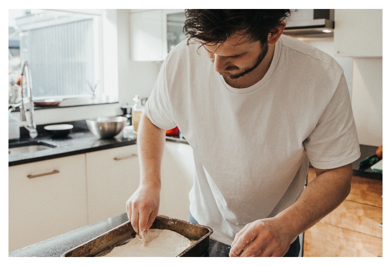 Vegan influencer PlantFuture kneading dough in his kitchen